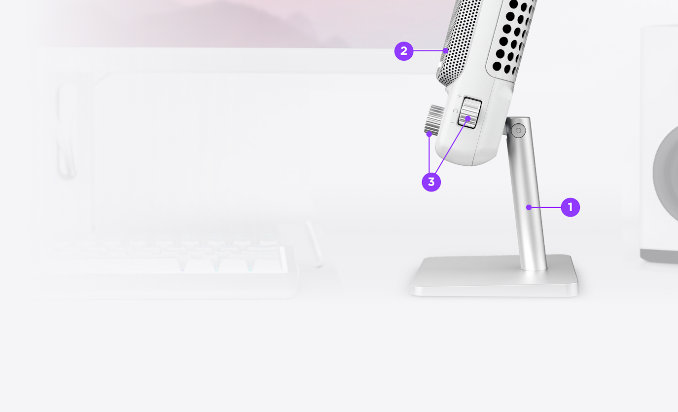 Side view of white Capsule Elite microphone sitting on a desk with diagram callouts to various features